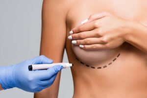 Dermatologist examining skin during clinical consultation