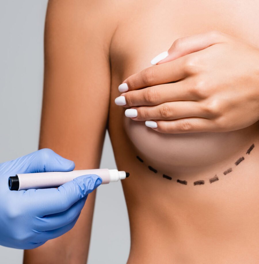 Dermatologist examining skin during clinical consultation